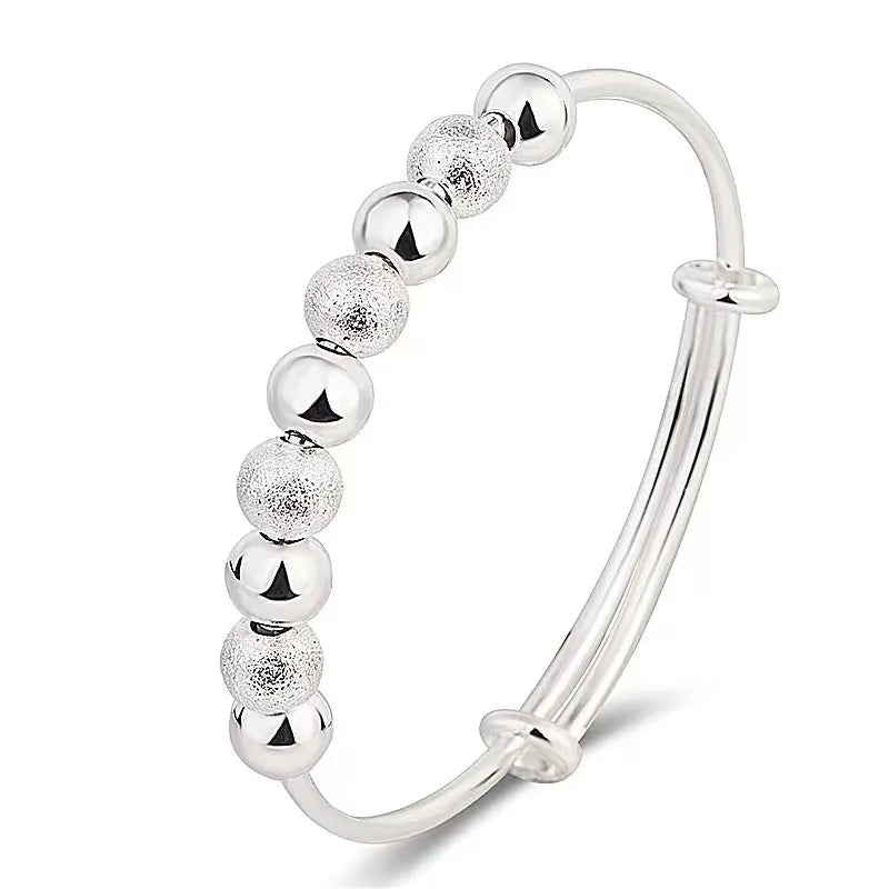 Delicate women's silver party bracelet featuring a luxurious charm, an elegant accessory for any event.