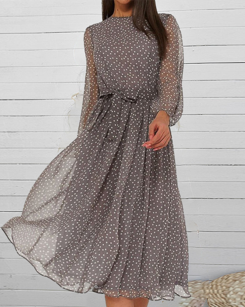 Flattering women's A-line knee-length polka dot dress, a chic and versatile option for casual spring outings.