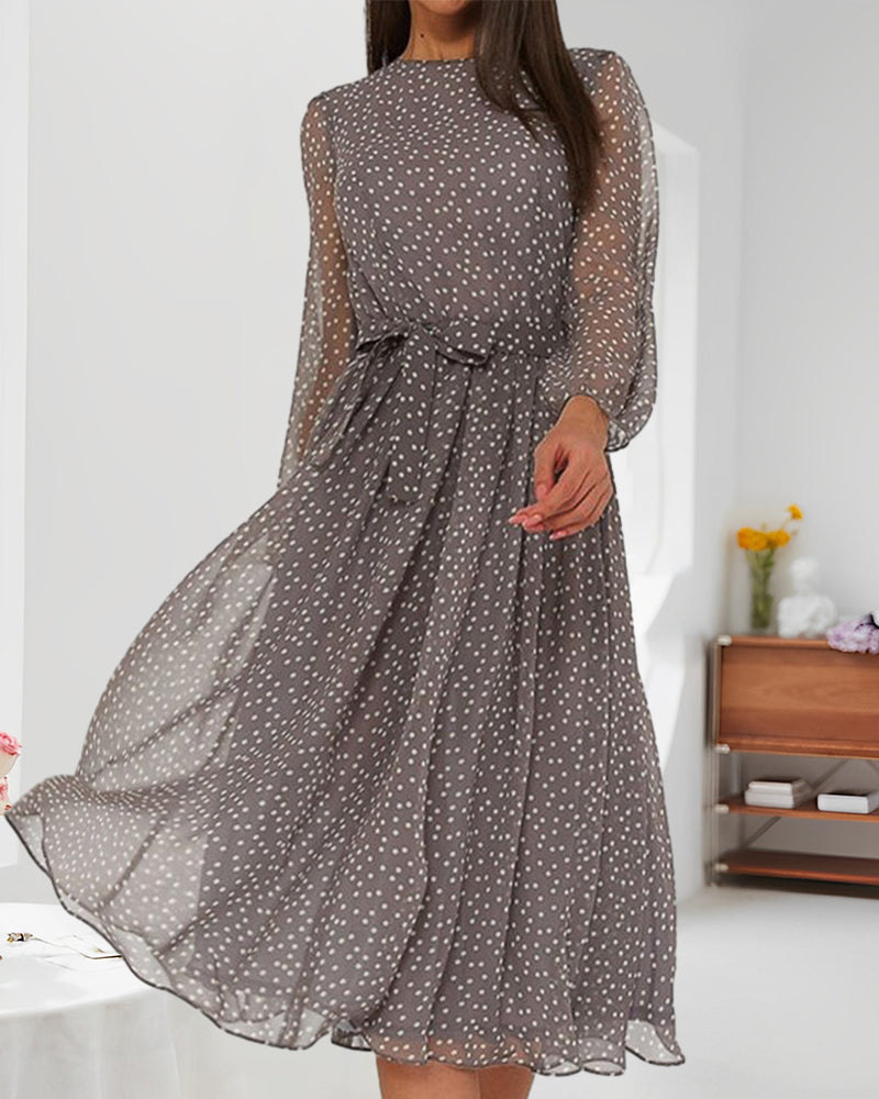 Relaxed fit women's polka dot A-line dress with round neck and chic lantern sleeves, ideal for autumn comfort.