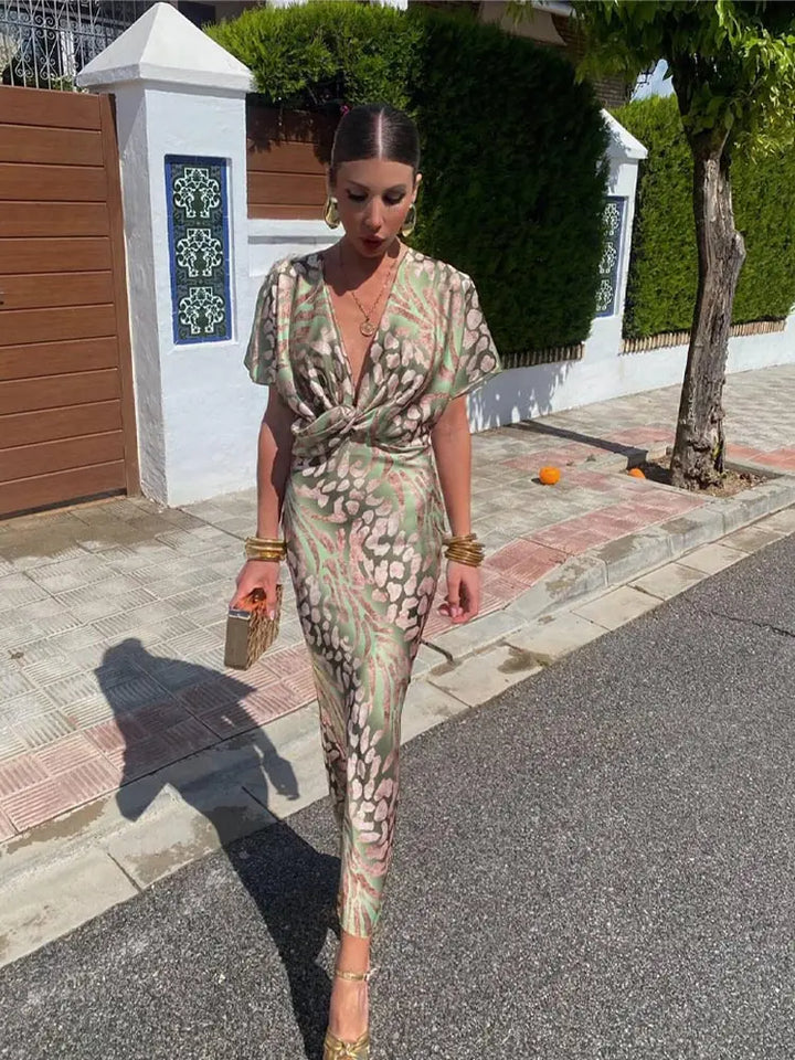 Relaxed fit women's printed wrap midi dress, perfect for summer parties & vacation style.