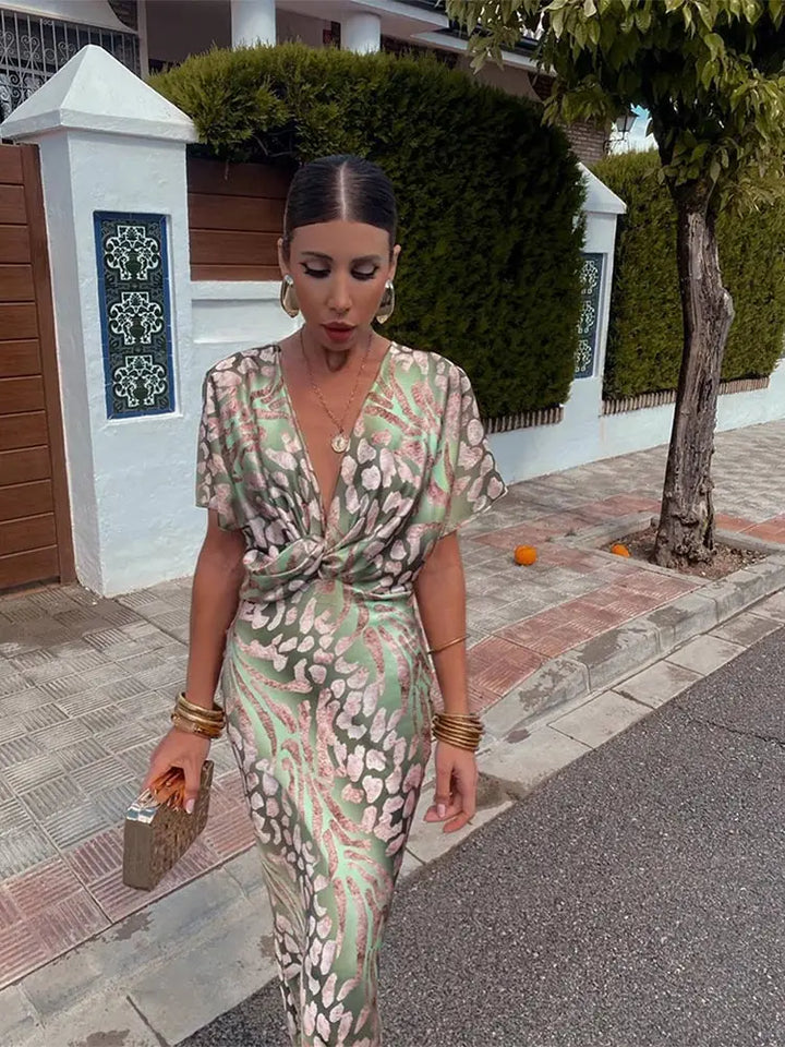 Abstract print midi wrap dress for women, offering an elegant & comfortable relaxed fit.