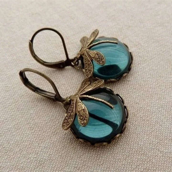 Women's elegant antique gold dragonfly earrings. Vintage, nature-inspired jewelry, perfect gift for her.