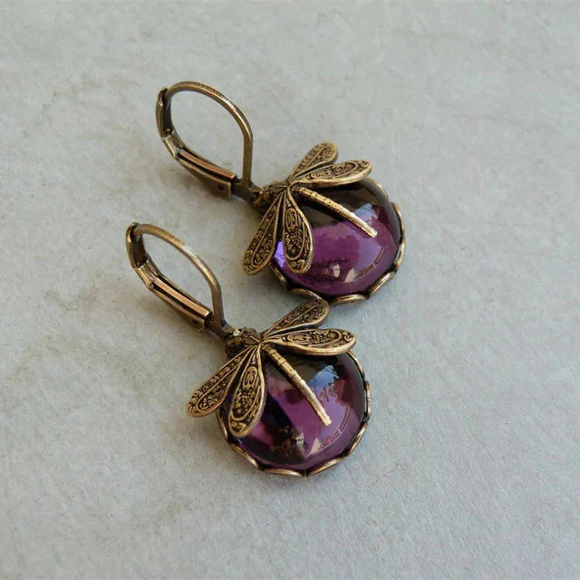 Pair of elegant antique gold dragonfly earrings. Vintage women's jewelry, nature-inspired, a thoughtful gift.