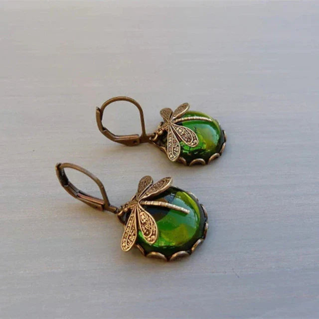 Radiant antique gold dragonfly earrings for women. Classic vintage-style jewelry with charming nature design.