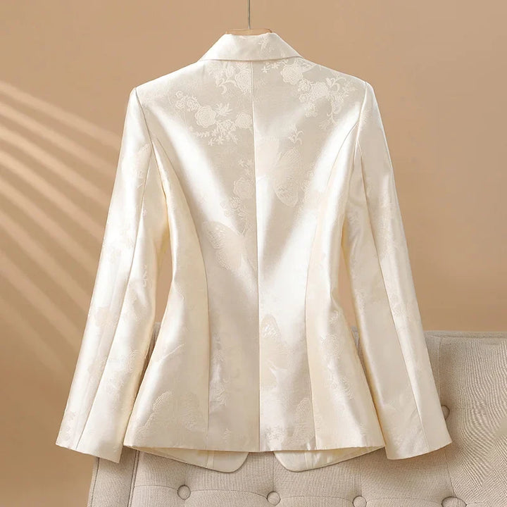 Tailored elegant pink blazer for women, featuring a beautiful rosette. Ideal for special occasions & office.