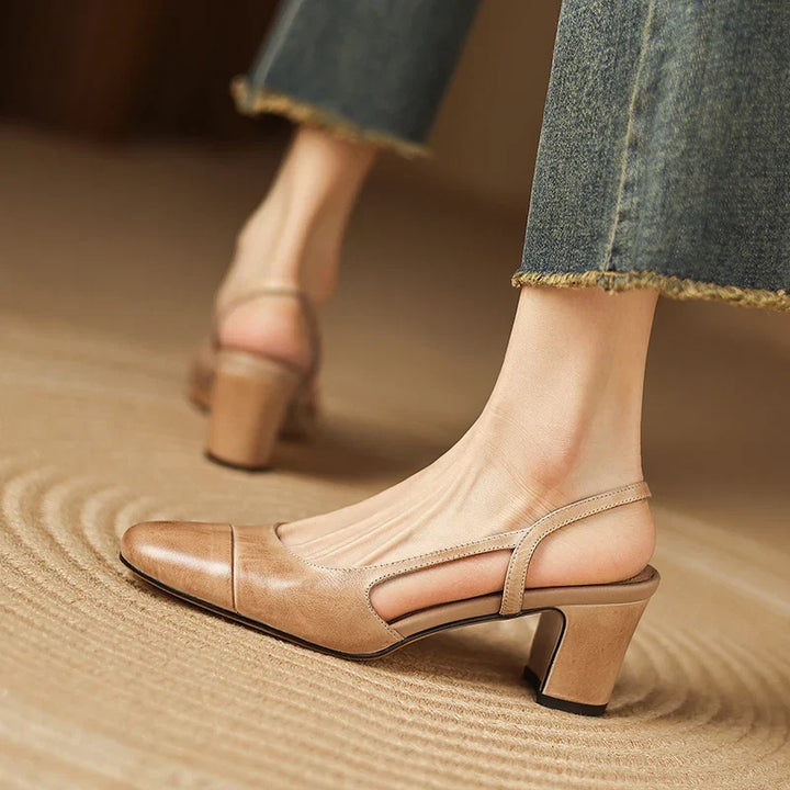 Stylish silver slingback block heels for women, offering all-day comfort, ideal for parties and elegant events.