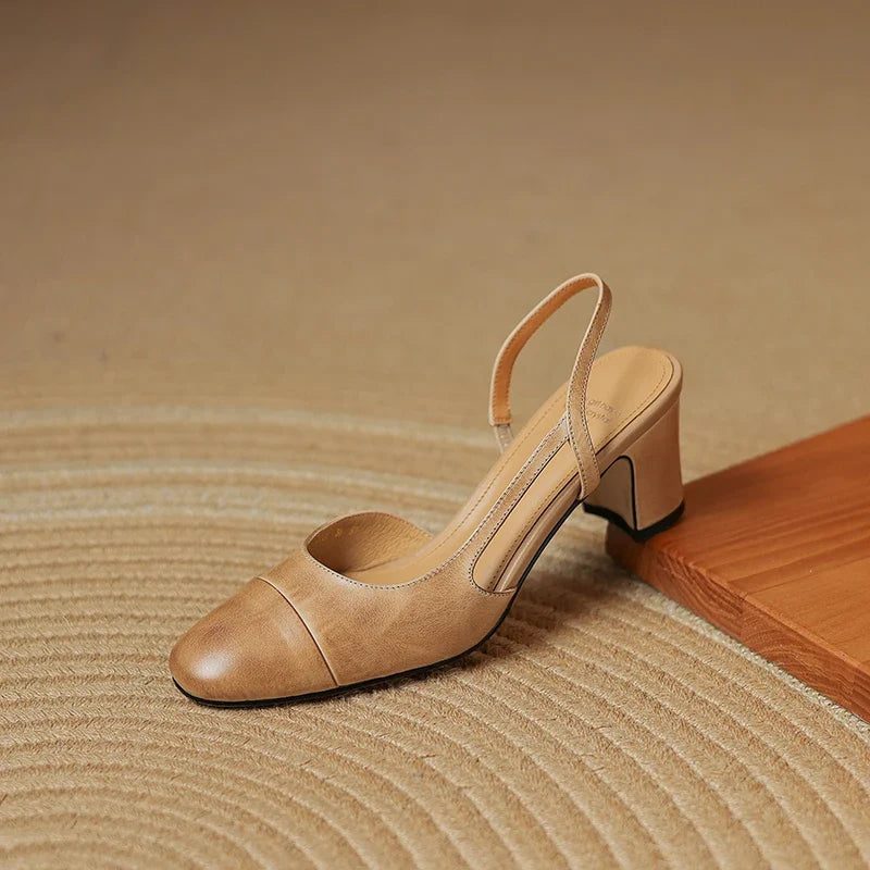 Elegant women's work heels: black slingback block heels with a round toe, designed for all-day comfort and professional style.