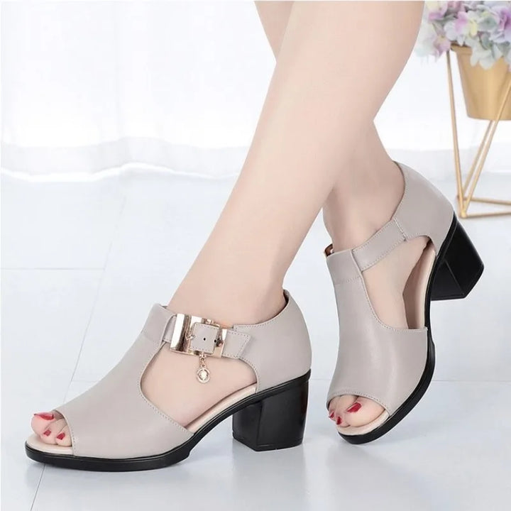 Close-up of women's elegant block heel with buckle detail, showcasing quality & chic style.