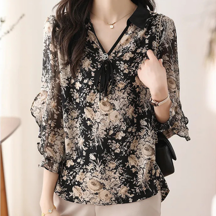 Women's elegant black floral collared blouse with long sleeves, perfect for sophisticated office or autumn wear.