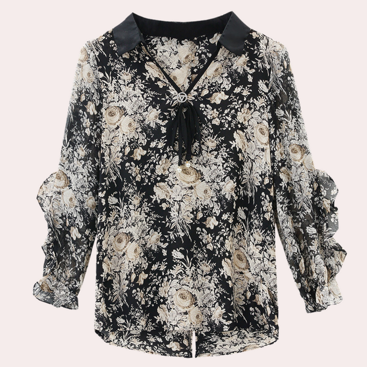 Feminine floral print black blouse with a collar, ruffle sleeves, and bow detail, ideal for versatile chic styling.