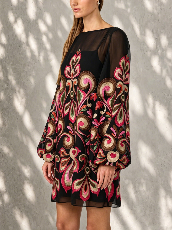 Trendy black floral mini shift dress with elegant sheer balloon sleeves & boat neck for evening wear.