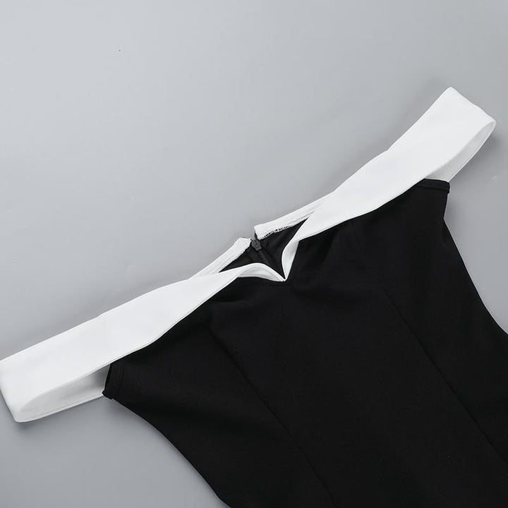 Chic women's cocktail mini dress, black with contrast detail, offering sophisticated style for special events.
