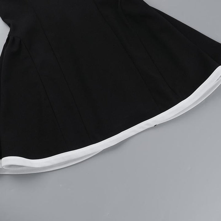Elegant women's mini dress, black with stylish contrast neckline, perfect for sophisticated evening events.