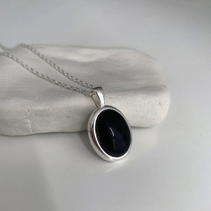 Exquisite black opal pendant necklace, an ideal elegant jewelry gift idea for women.