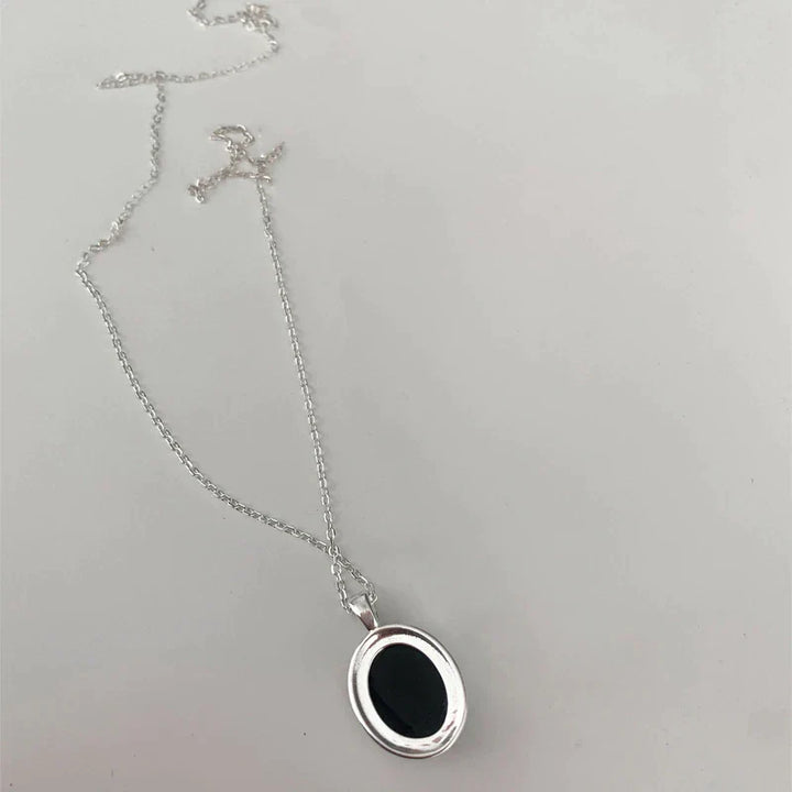 Elegant black opal pendant necklace, a luxurious women's gemstone jewelry piece for sophisticated style.