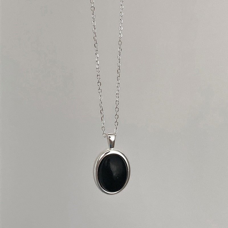 Shimmering black opal necklace with a unique pendant design, elegant fine jewelry for women.