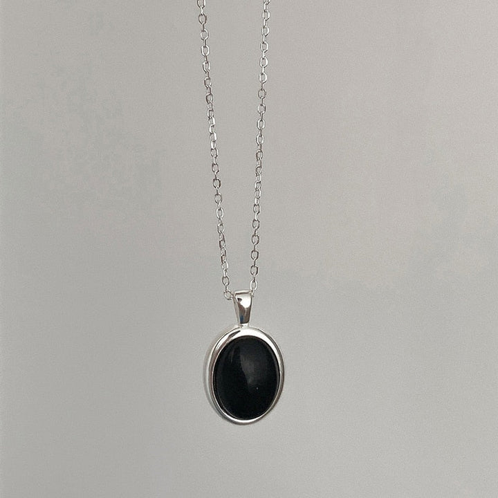 Shimmering black opal necklace with a unique pendant design, elegant fine jewelry for women.