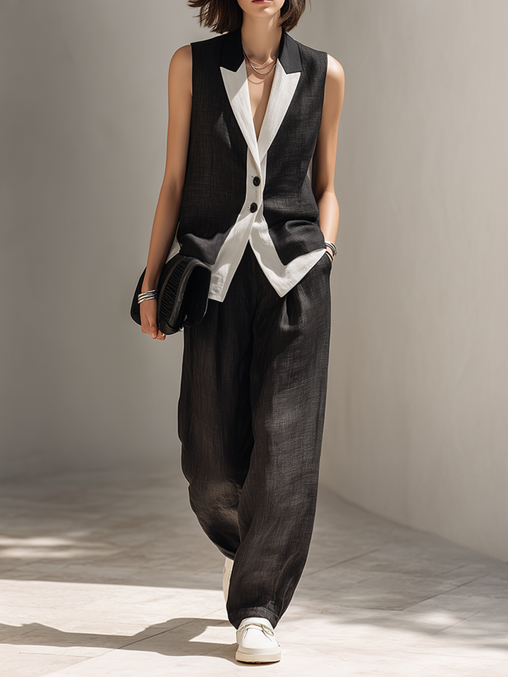 Women's elegant black two-piece set featuring a tailored vest & wide-leg pants. Perfect for chic professional or evening wear.
