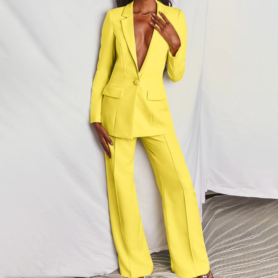 Women's elegant blazer & trouser set. Chic two-piece suit for modern professional workwear.