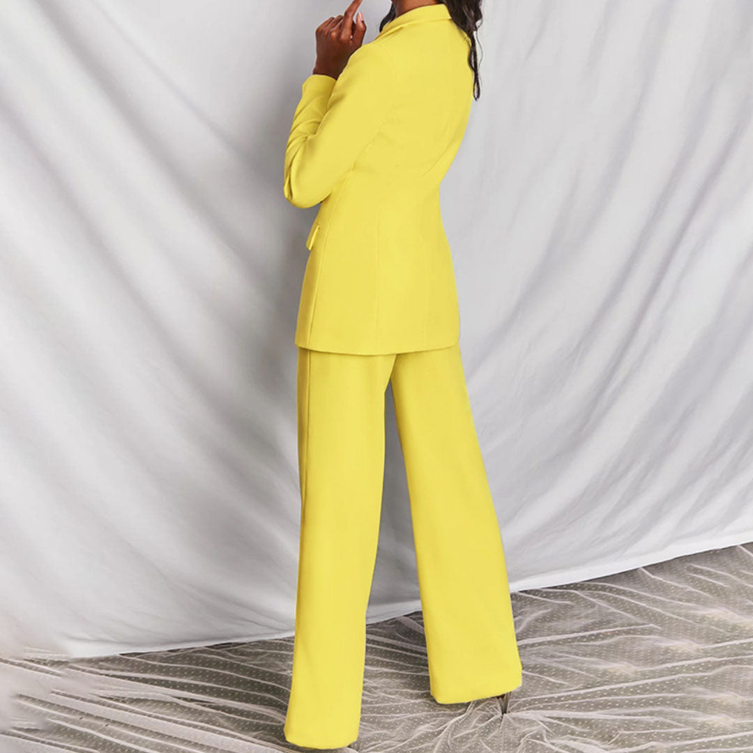 Modern women's two-piece suit. Versatile blazer & trouser set for work or formal events.
