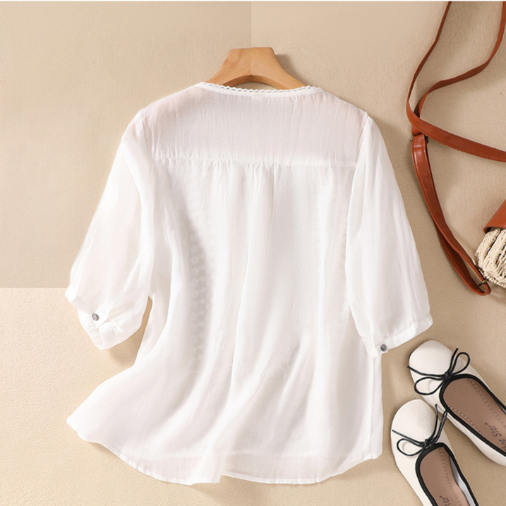 Stylish women's short sleeve lace top, a breathable and casual blouse for warm weather.