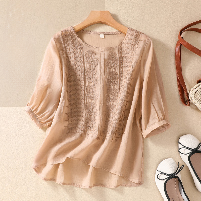 Casual yet elegant women's lace top, a stylish short sleeve blouse perfect for any warm weather occasion.