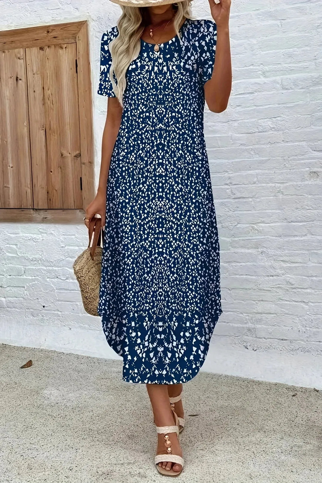 Flowing women's blue floral maxi dress, elegant summer style for ladies. Long, comfortable vacation wear.
