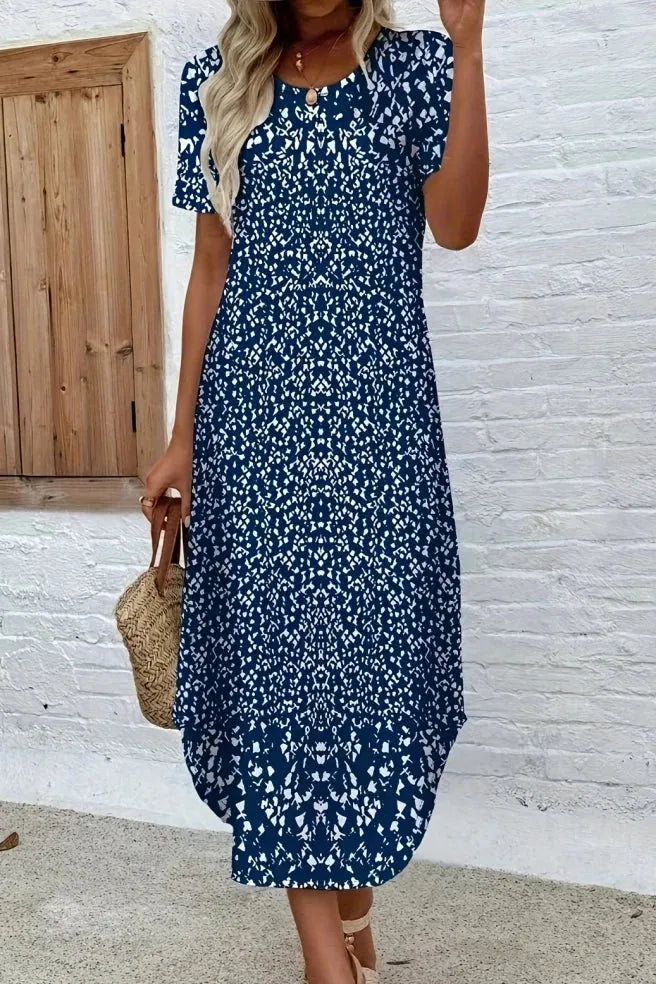 Ladies' elegant blue floral maxi dress with flowing silhouette, perfect for summer events & boho chic style.