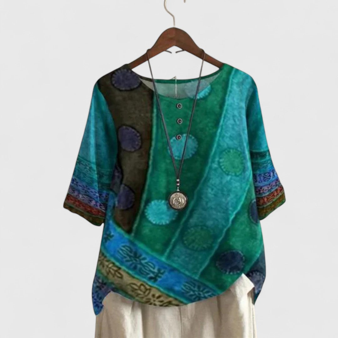 Stylish women's boho patchwork long sleeve top featuring unique prints and decorative buttons.