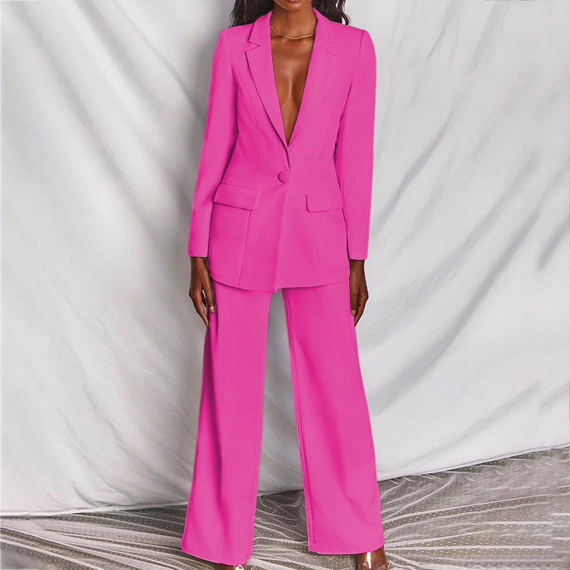 Elegant black women's tailored trouser suit, a chic professional formal outfit for business wear.