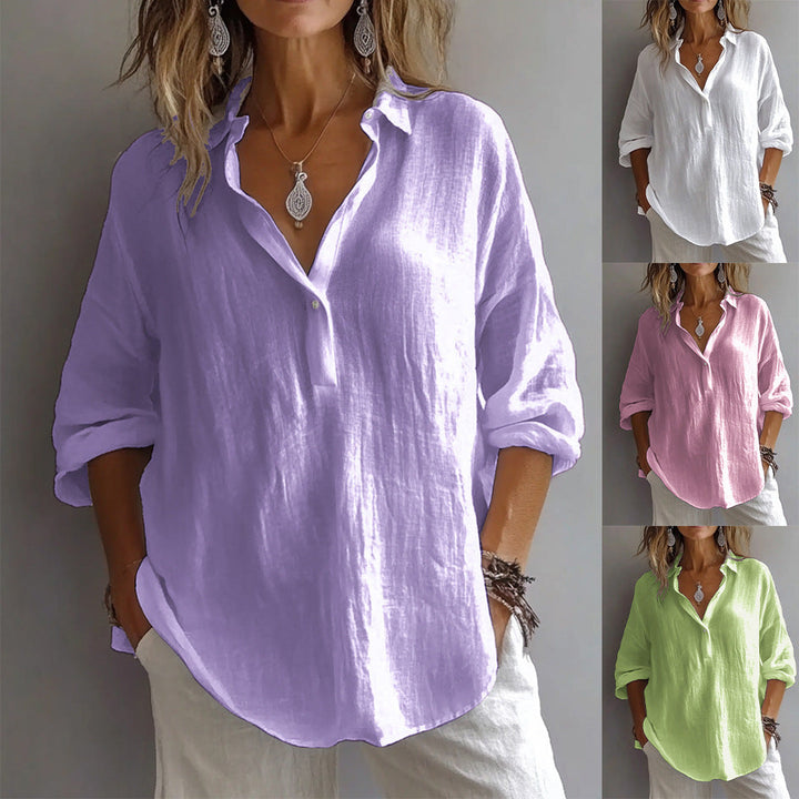 Chic women's button-down shirt featuring wide, flowy sleeves, perfect for versatile summer wear.