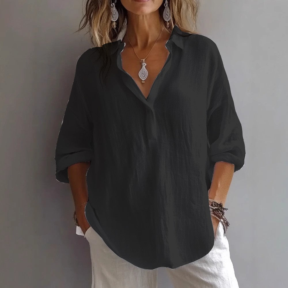 Summer-ready women's button-down shirt with wide, flowy sleeves, offering a chic and relaxed fit.