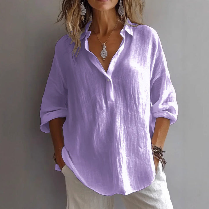 Women's relaxed fit button-down shirt with wide sleeves, a versatile casual top for everyday elegance.