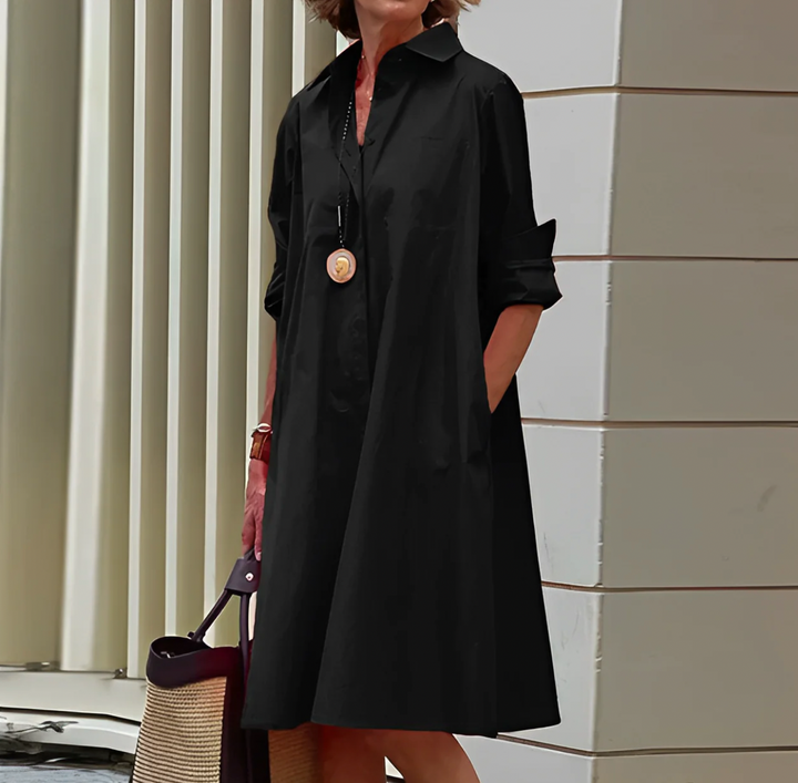 Versatile women's short shirt dress with button-front, relaxed fit; suitable for workwear or casual elegance.
