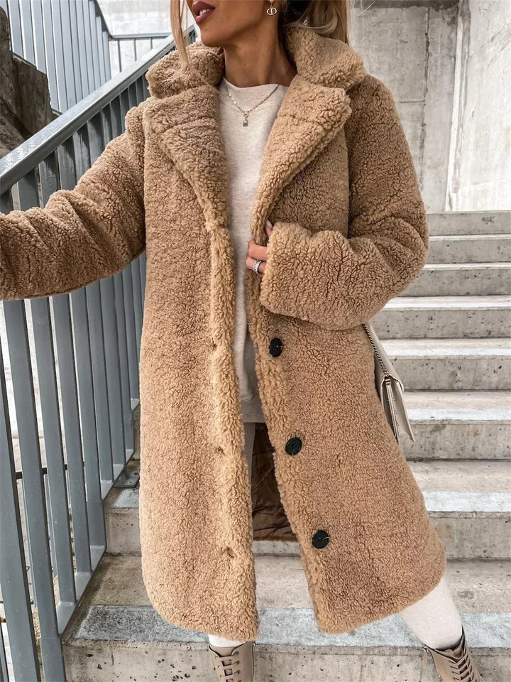 Stylish women's longline coat, a chic and versatile outerwear piece for winter fashion.