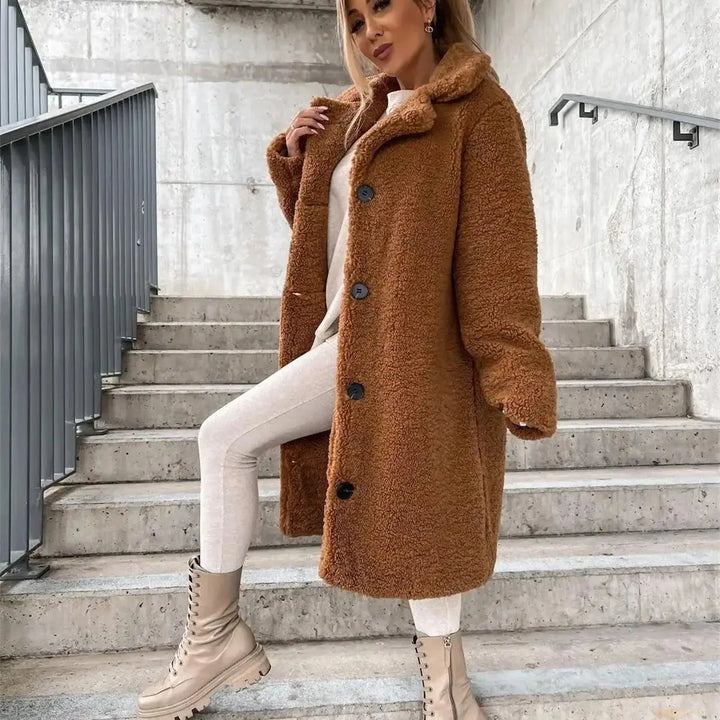 Elegant women's fall fashion coat, a longline style with a relaxed, comfortable fit.