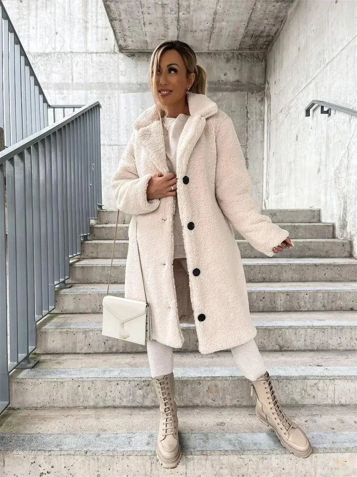 Elegant longline women's coat, a casual yet stylish jacket with button front closure.