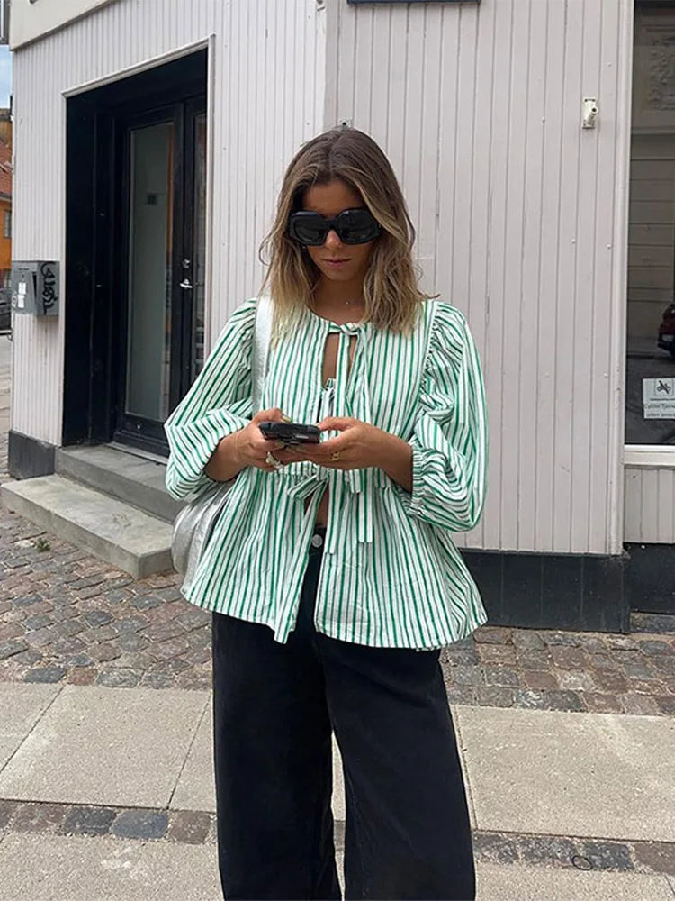Casual women's checked long sleeve blouse with stylish puff sleeves. Perfect fashion top.