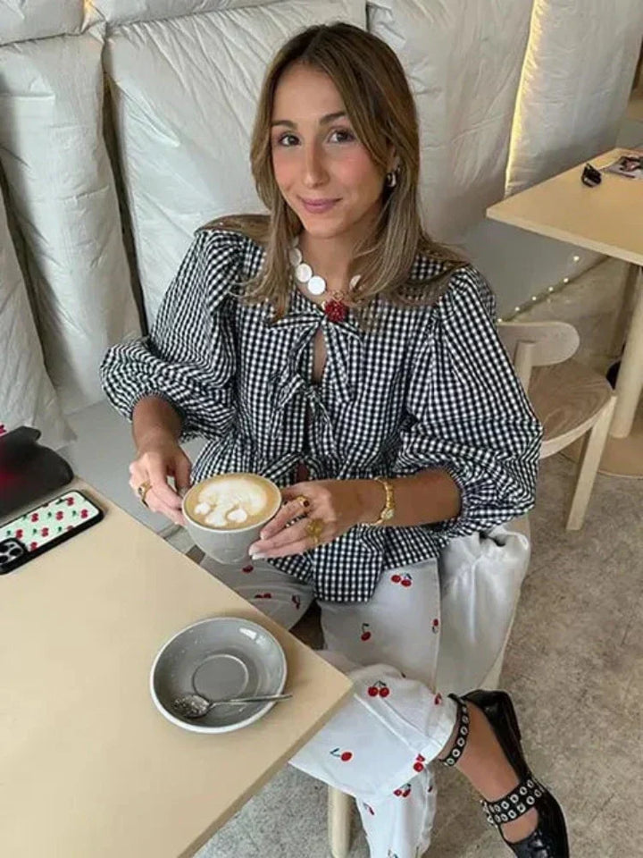 Classic women's checked blouse, a long sleeve top with stylish puff sleeve detail.