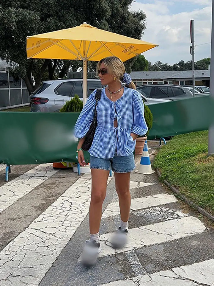 Women's casual checked puff sleeve blouse. Versatile long sleeve top for everyday fashion.