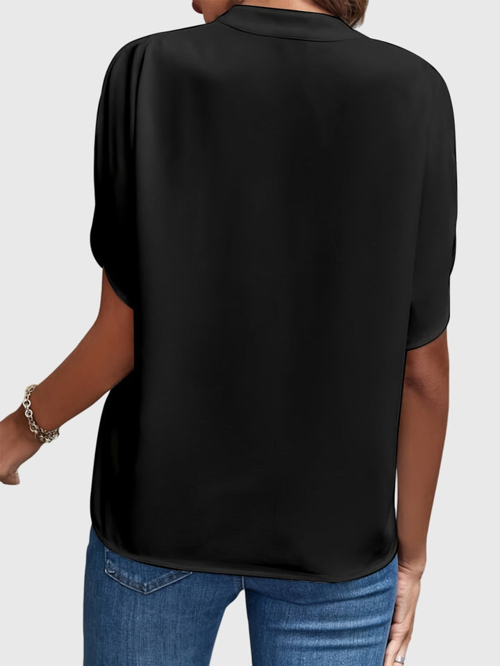 Sophisticated women's blouse, an elegant long sleeve shirt suitable for office attire.