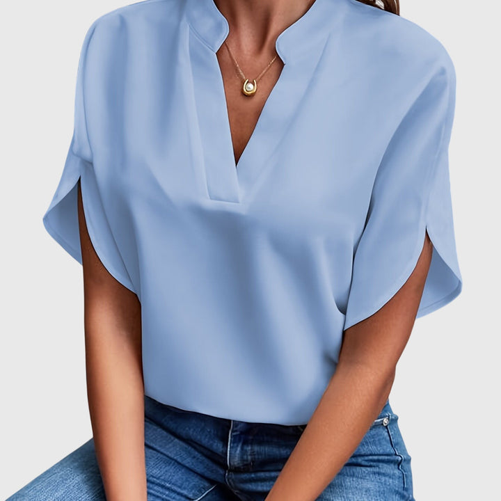 Fashion-forward women's top, a chic and versatile blouse for both formal and casual settings.