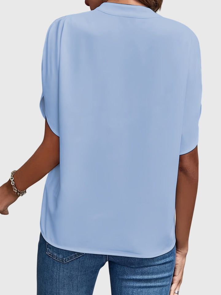Elegant women's long sleeve blouse, offering a chic look for office, casual, or formal wear.