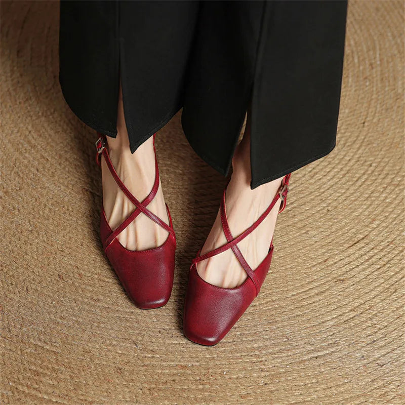 Comfortable black block heels for women, featuring a secure adjustable strap & non-slip sole.