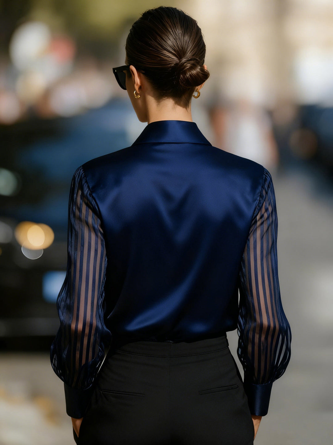Versatile women's top, a button-up collared blouse with beautiful sheer stripe sleeves.