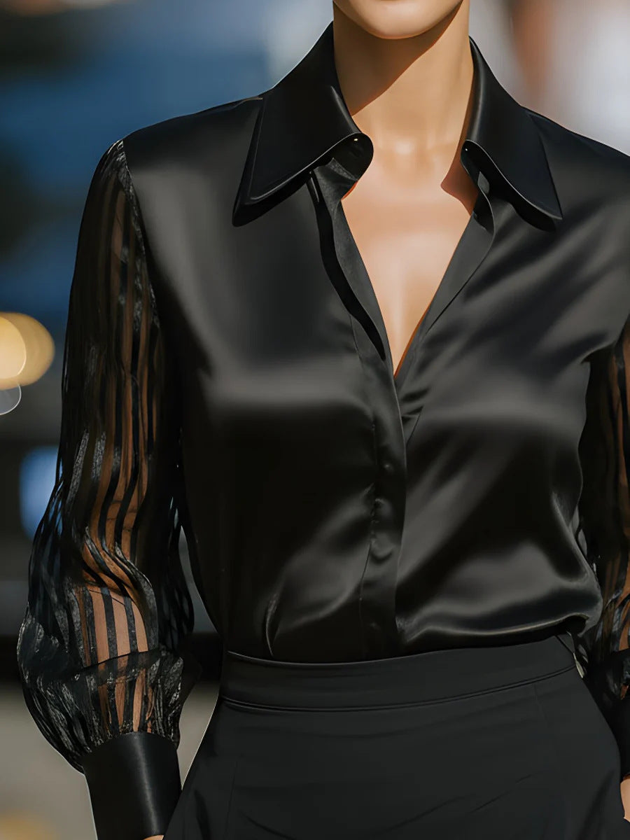 Elegant women's collared blouse with sheer stripe sleeves, perfect for a polished professional look.