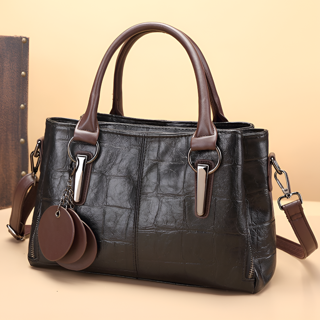 Stylish women's croc embossed Boston bag with sturdy top handle and removable shoulder strap. Perfect everyday accessory.