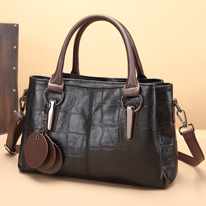 Stylish women's croc embossed Boston bag with sturdy top handle and removable shoulder strap. Perfect everyday accessory.