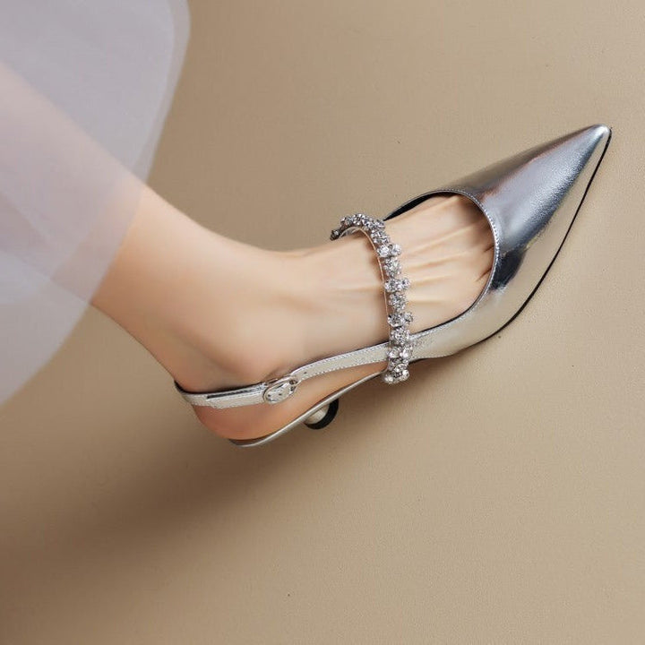 Women's elegant crystal slingback heels with a pointed toe for formal occasions.