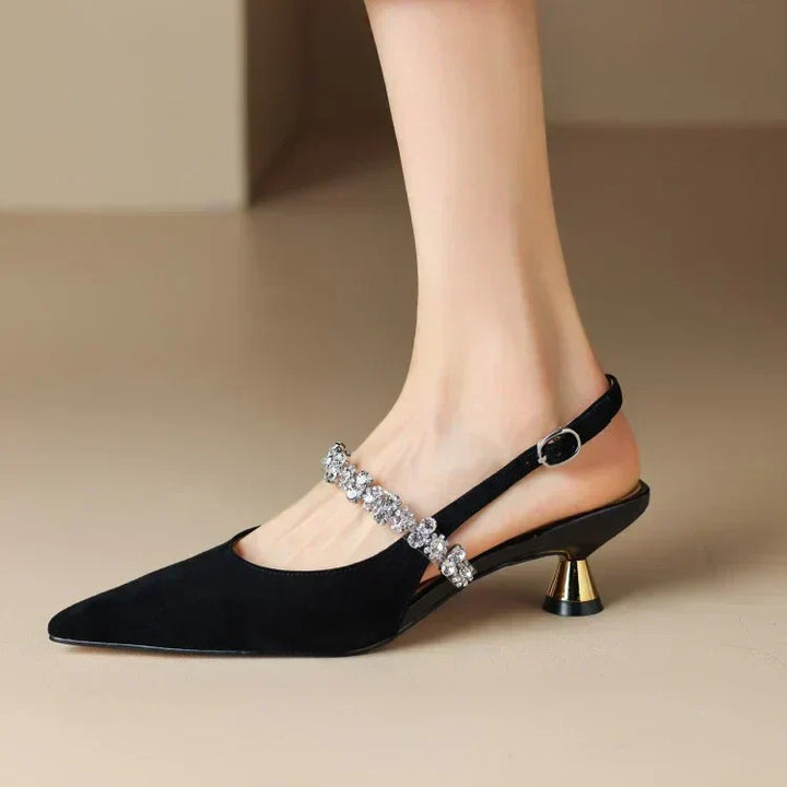 Stunning women's crystal slingback pumps with an elegant pointed toe for evening wear.